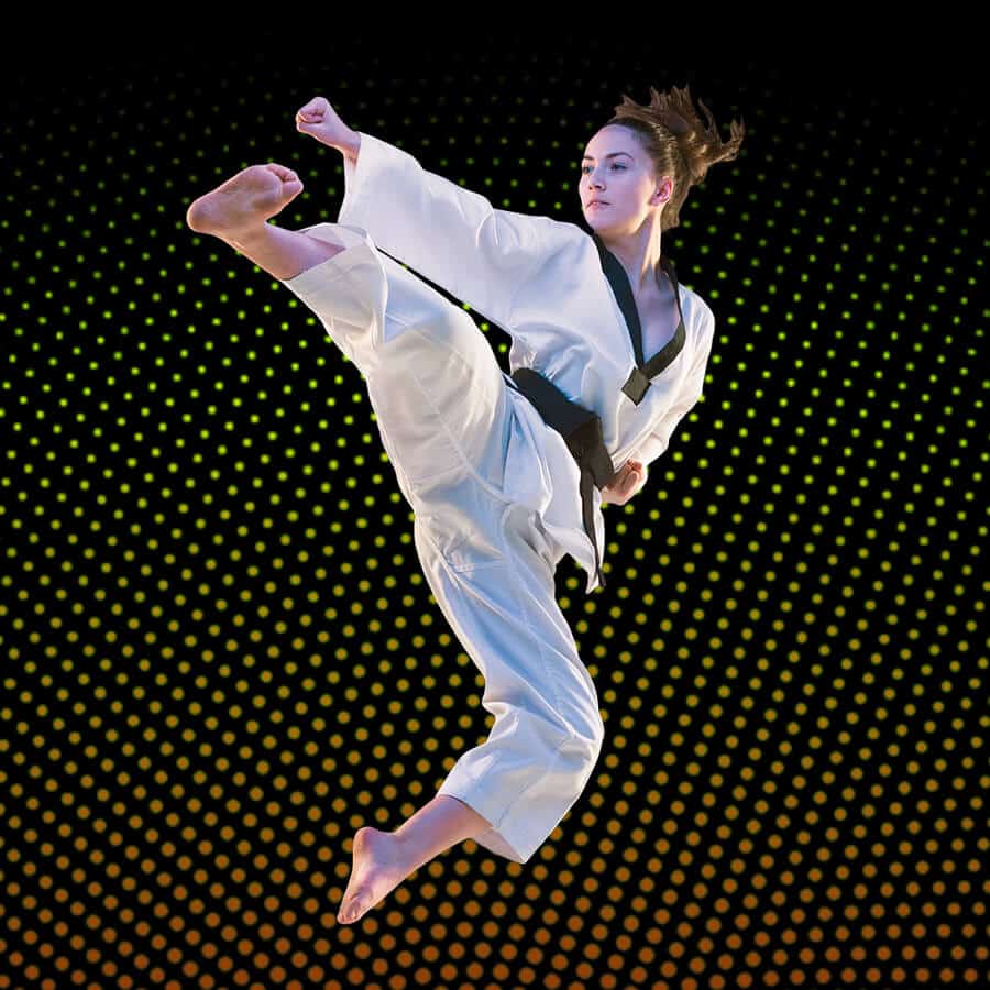 Martial Arts Lessons for Adults in Waco TX - Girl Black Belt Jumping High Kick