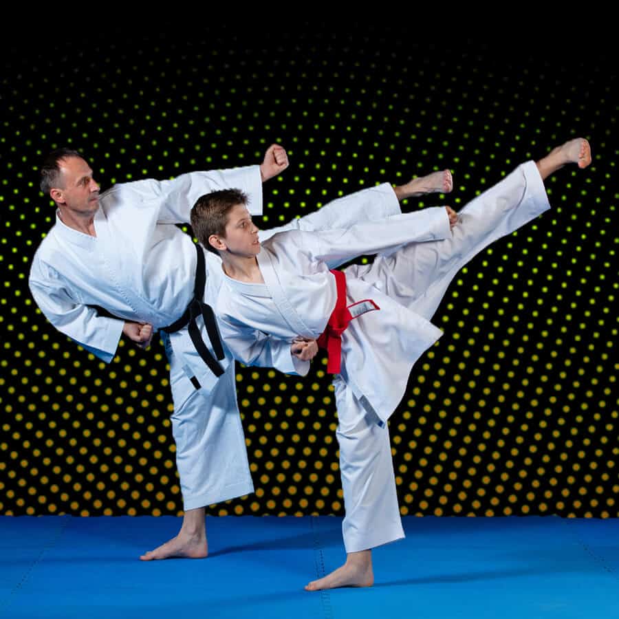 Martial Arts Lessons for Families in Waco TX - Dad and Son High Kick